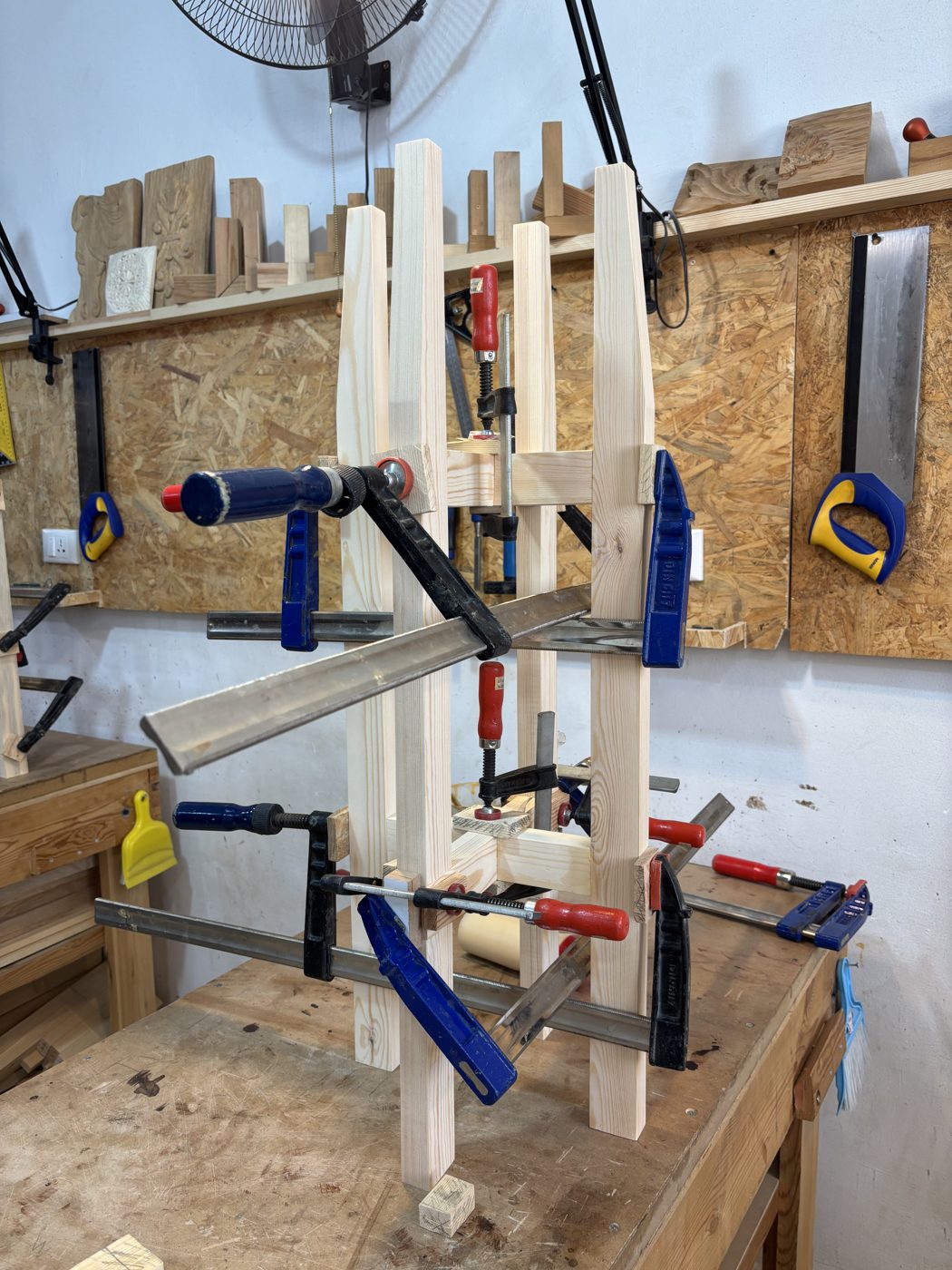 Before: the plant stand clamped up during glue-up on the workbench